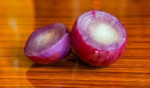 Onion pieces on the table Stock Photos