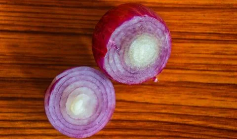 Onion pieces on the table Stock Photos