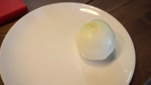 Onion on a plate Stock Footage 159881203