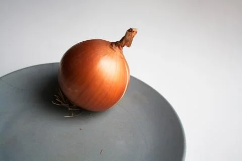 Onion on plate Stock Photos