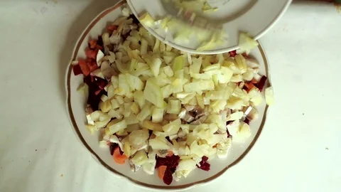 Onion. Preparation of a dish herring under a fur coat. Stock Footage 70269446