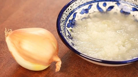 Onion quickly cut into slices on chopping board Stock Footage 78672242