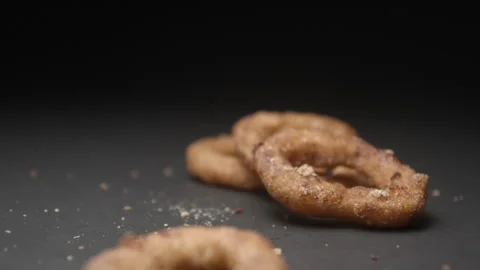 Onion rings close up slow motion studio, tasty fast food Video stock 144801134