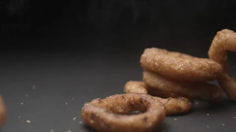 Onion rings close up slow motion studio, tasty fast food Stock Footage 144801173