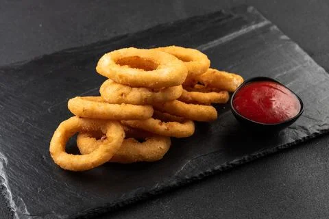 Onion rings deep-fried in breaded onions. Crispy onion rings. Fast food Stock Photos