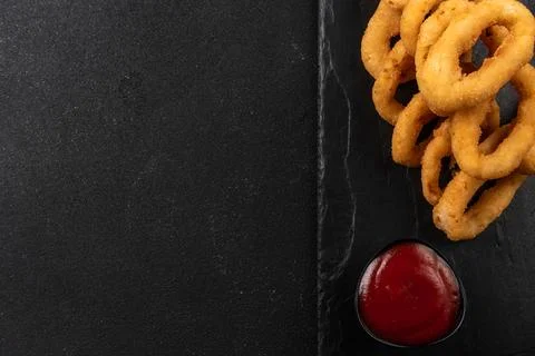 Onion rings deep-fried in breaded onions. Crispy onion rings. Fast food. Copy Photos