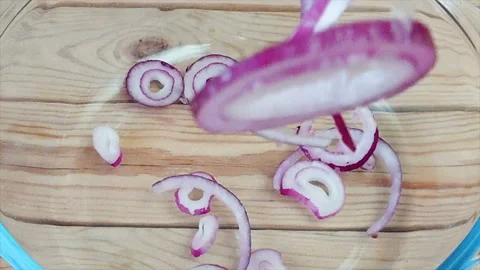 Onion rings fall down into the plate, cooking salad, super slow motion 스톡 동영상 101431871