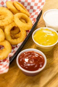 Onion rings junk food fast food greasy side dish tasty epicurean snack Stock Photos