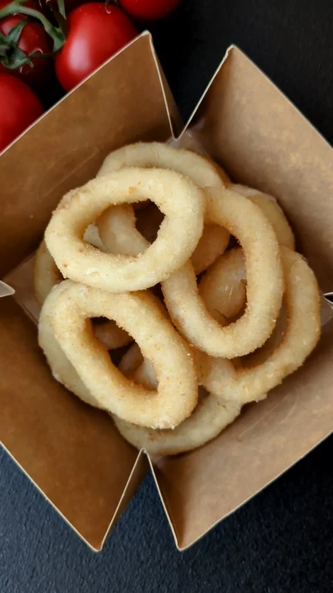 Onion rings or squid rings fries crispy, savory with sauce Video stock 307637013