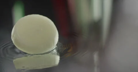 Onion rings scroll on a mirror surface Stock Footage 198561250