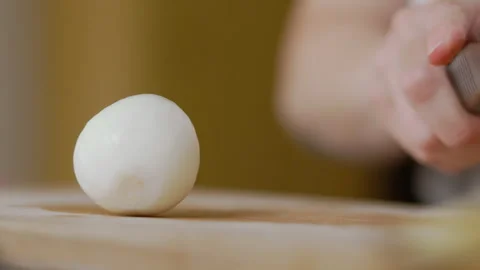 Onion rolling on the table Stock Footage 250183186