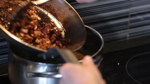 Onion into saucepan Stock Footage 48014627