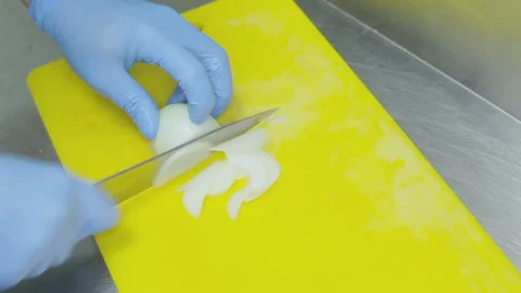 Onion slicing chef. Stock Footage 93372283