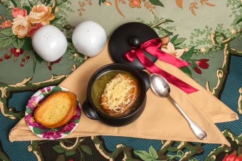 Onion soup on decorated table with eggs Stock Photos