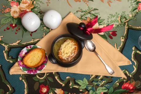 Onion soup on decorated table with eggs Stock Photos