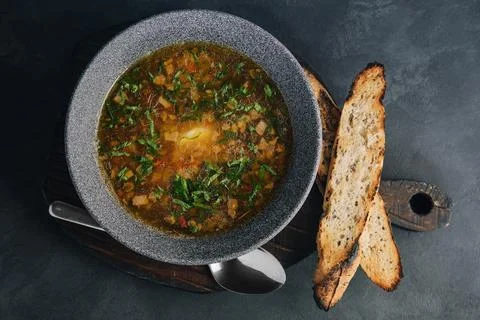 Onion soup with roasted bread top view Stock Photos