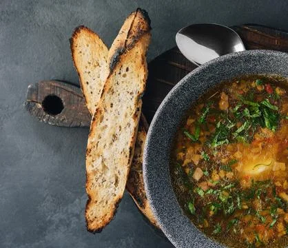 Onion soup with roasted bread top view Stock Photos