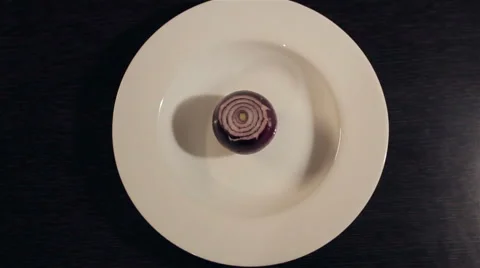 Onion on a white plate Stock Footage 47795748