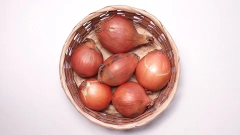 Onions in a basket. Stock Footage 127573808