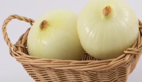 Onions in basket Stock Photos