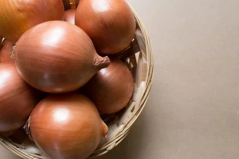 Onions in basket Stock Photos