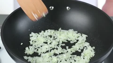 Onions being fried in a pan Stock-Footage 24671145