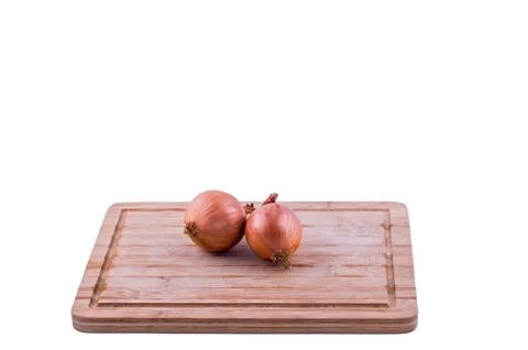 Onions on chopping board 写真素材