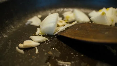 Onions fried in a pan, close up Stock Footage 311108102
