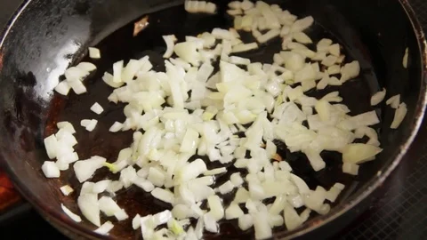 Onions fried in a pan Video stock 71878401