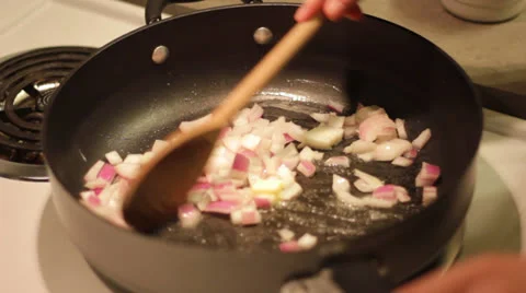 Onions in pan Stock Footage 24636320