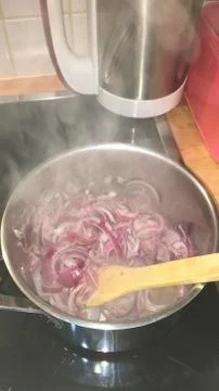 Onions in a pot for dinner Stock Photos