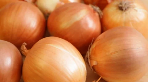 Onions on rotating stand - closeup Stock Footage 50975225