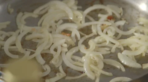 Onions Sautéing in Pan Stock Footage 27295905