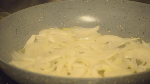 Onions Simmering On Pan Stock Footage 64482055