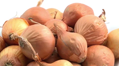 Onions swiftly rotating under studio lighting (Faster) Video stock 59776973