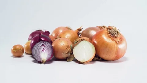 Onions on white background, panning Video stock 75863233