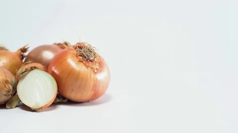 Onions on white background, sliding Video stock 75823999