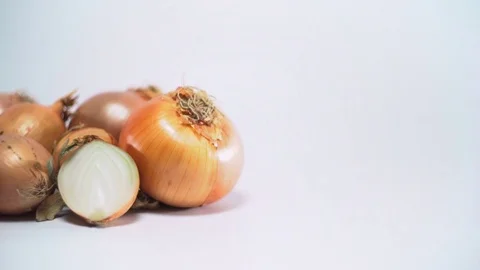 Onions on white background, sliding, shallow Depth of field Video stock 75783388