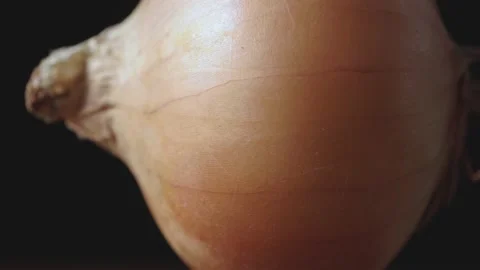 Onions on a wooden surface close-up Stock Footage 131618026
