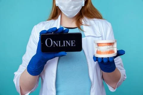 Online appointment to dentist concept. Using phone to sign up to the doctor. Stock Photos