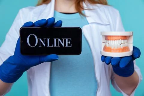 Online appointment to dentist concept. Using phone to sign up to the doctor. Stock Photos