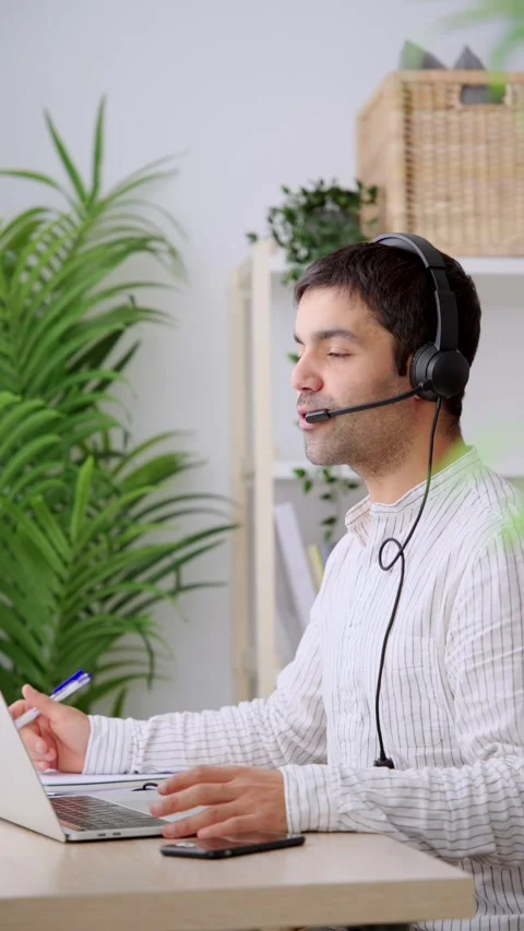 Online assistance worker talking on headset Stock Footage 262107938