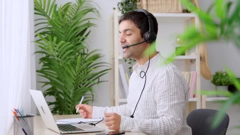 Online assistance worker talking on headset Stock Footage 263159610