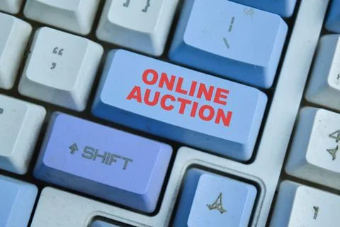 Online auction on the button keyboard. For an auction held Stock Photos