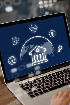 Online banking invoice payment process on a laptop screen in a modern setting Stock Photos