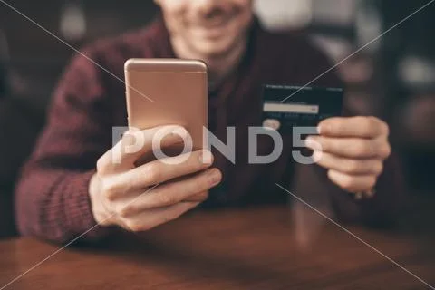 Online banking with smart phone, rewrite number of credit card Stock Photos
