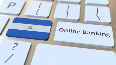 Online Banking text and flag of Nicaragua on the keyboard. Internet finance Stock Footage 127865070