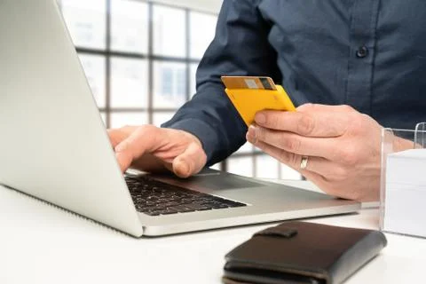 Online banking using a card reader on a laptop Stock Photos