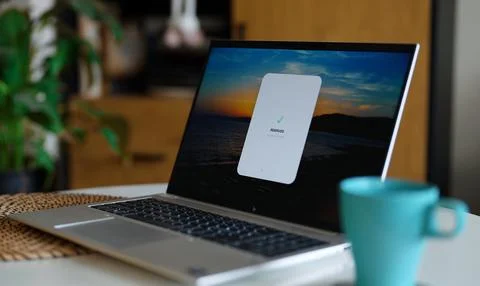 Online booking reservation confirmation message on laptop screen. Stock Photos