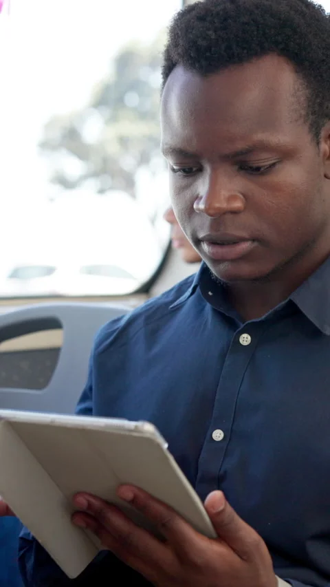Online, business man and tablet on bus for morning commute, travel schedule and Stock Footage 306461353